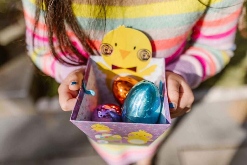 Photo by RDNE Stock project: https://www.pexels.com/photo/girl-holding-chocolate-eggs-in-box-7281802/