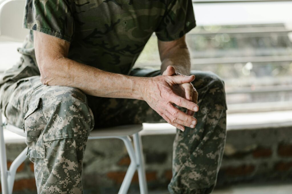 Photo by RDNE Stock project: https://www.pexels.com/photo/man-in-green-and-brown-camouflage-shirt-7468215/