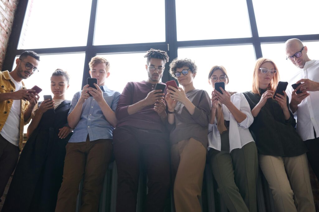 Photo by fauxels: https://www.pexels.com/photo/people-standing-next-to-window-using-their-phones-3183138/